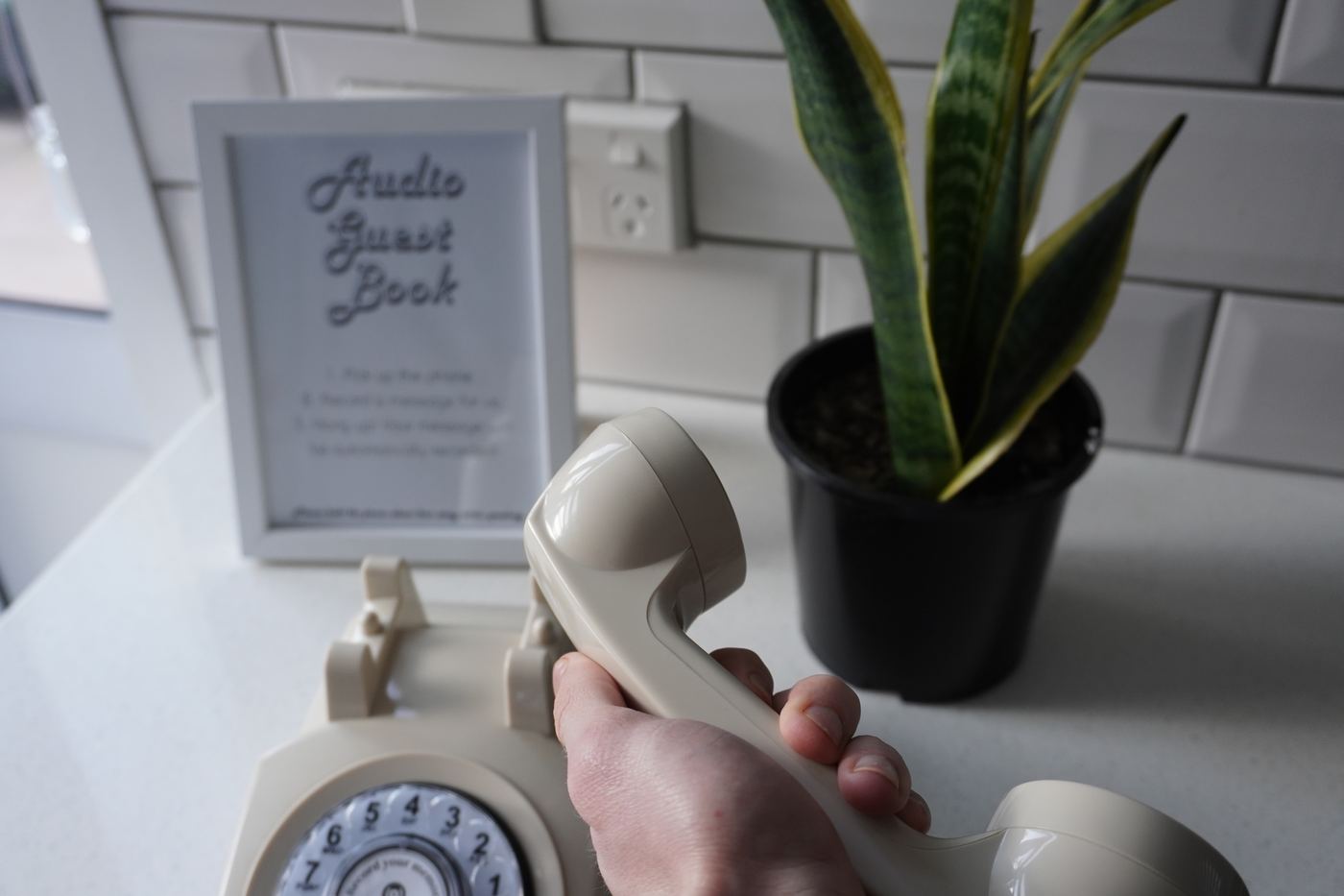Guest picking up the audio guestbook handset